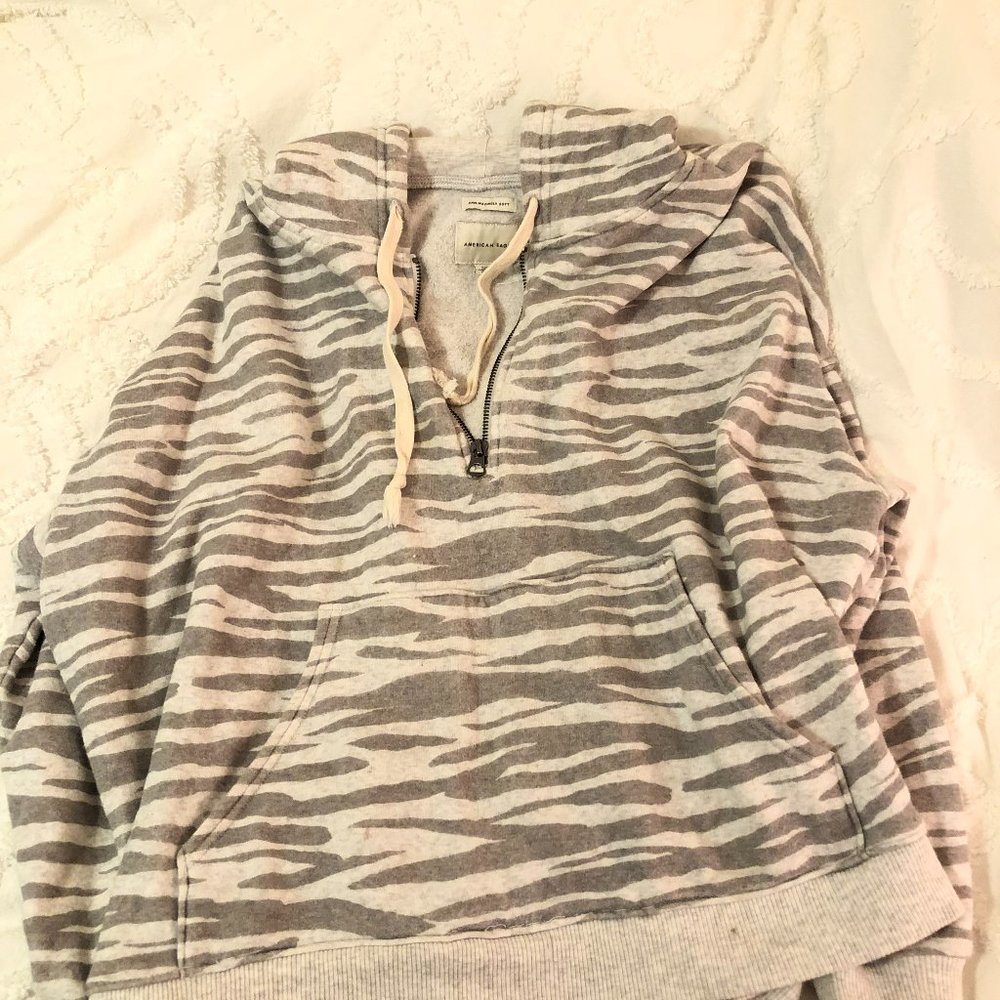 Animal print hoodie/quarter zip. Grey and white. Front pocket